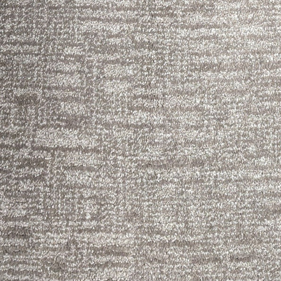 A close up of a gray carpet texture.