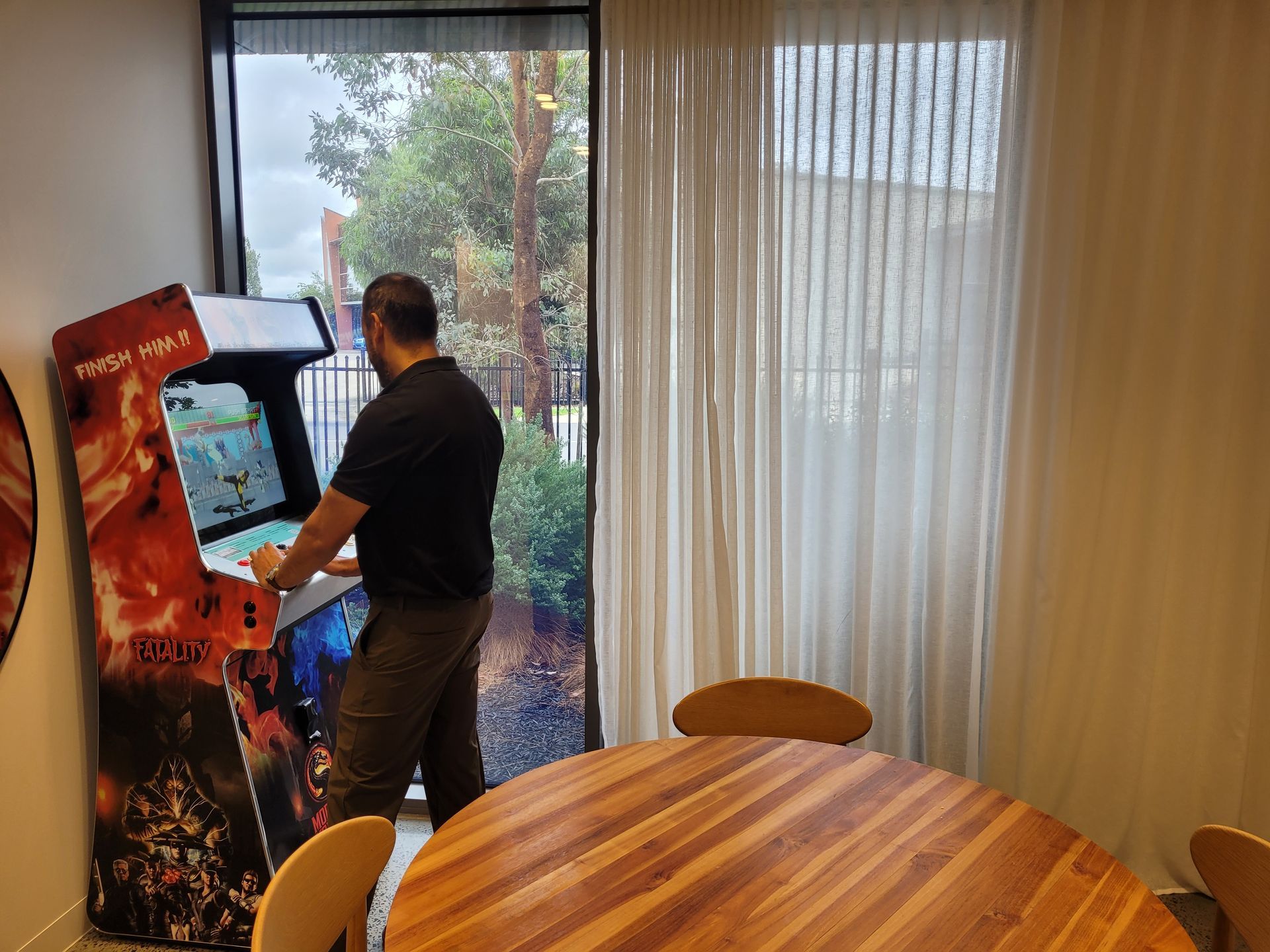 Miniature golf course set up on a grassy lawn, with a central gazebo and several putting greens.