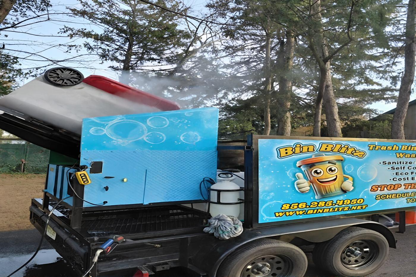 Bin Blitz employee cleaning garbage bin curbside in Vineland, New Jersey