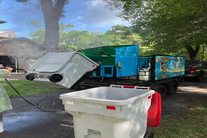 Bin Daddy Pro technician performing curbside bin wash