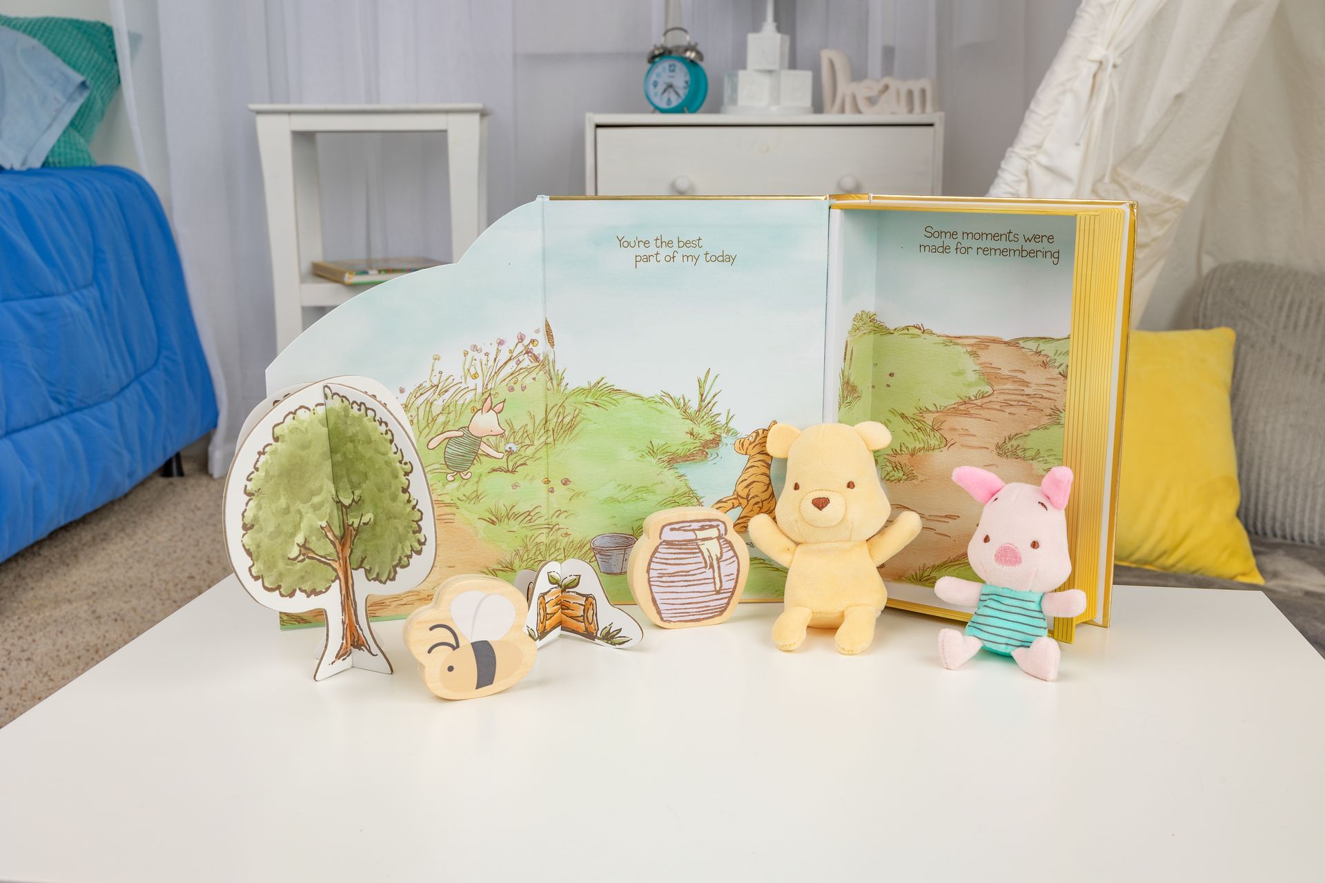 A table with a bunch of stuffed animals and a map on it.