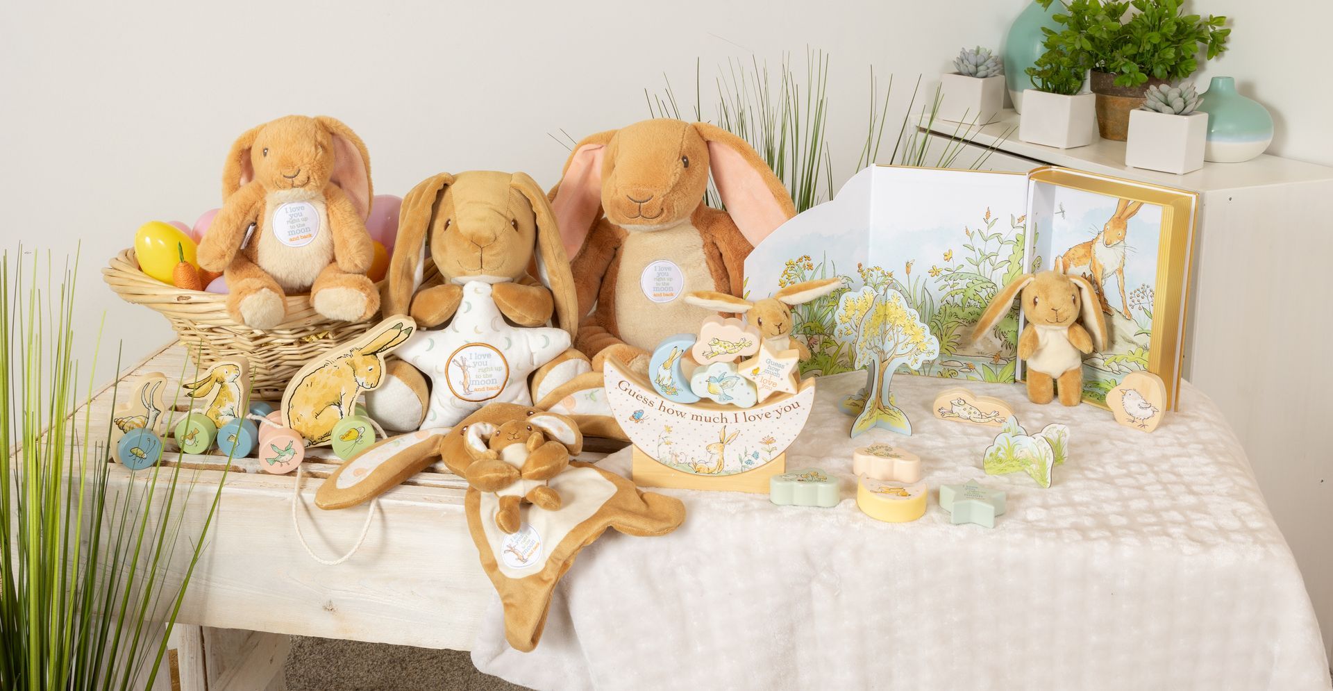 A table topped with a variety of stuffed animals and easter decorations.