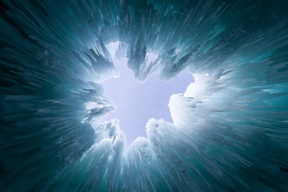 Looking up into the sky through a hole in the ice.