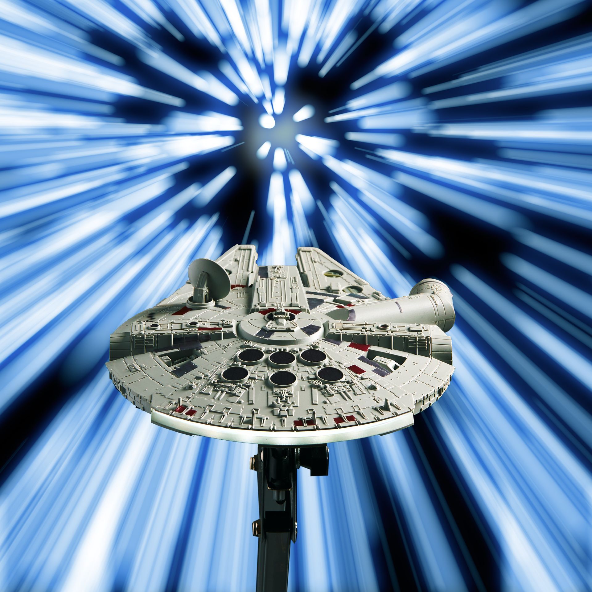 A model of the millennium falcon is flying through the air