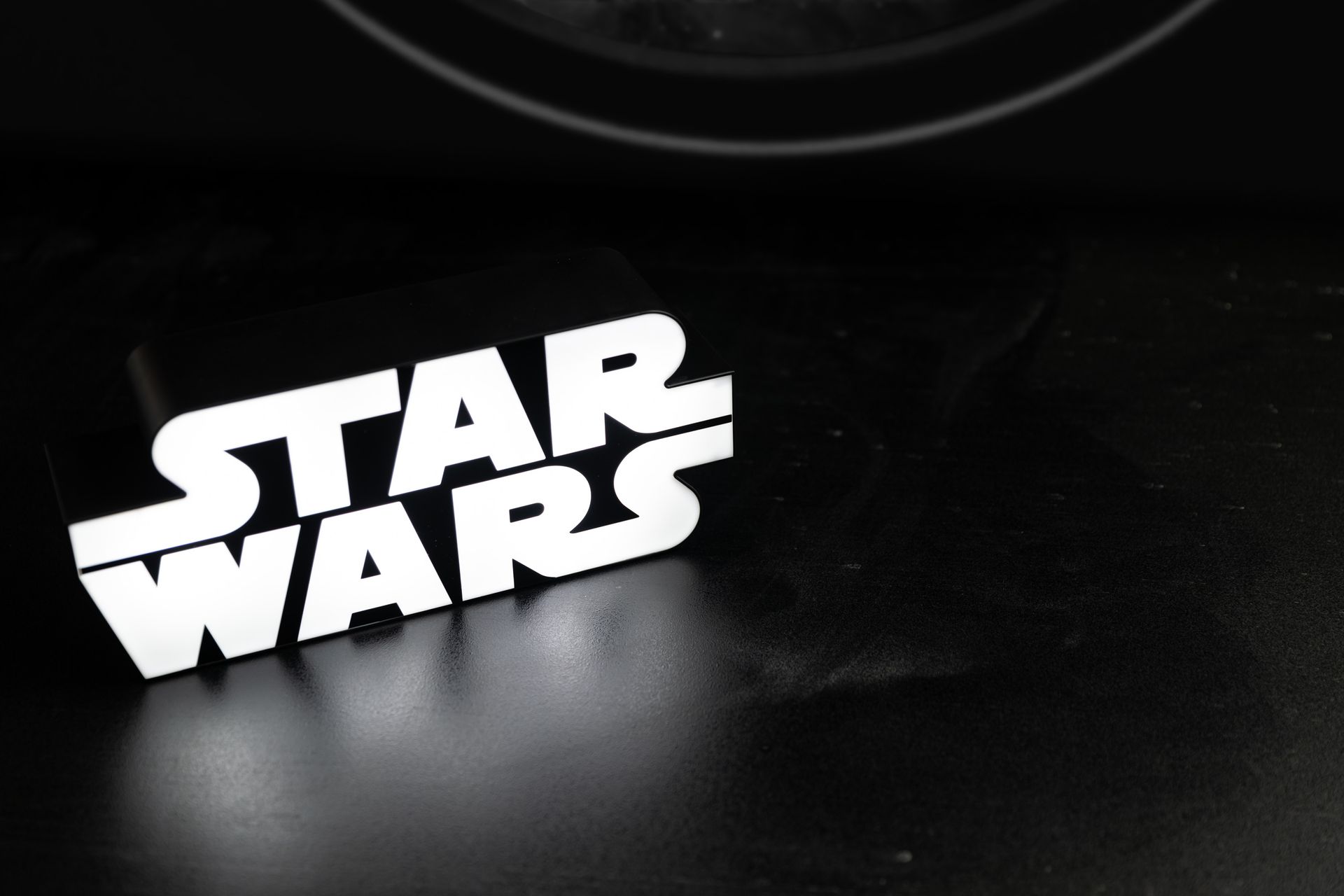 A star wars logo on a black surface
