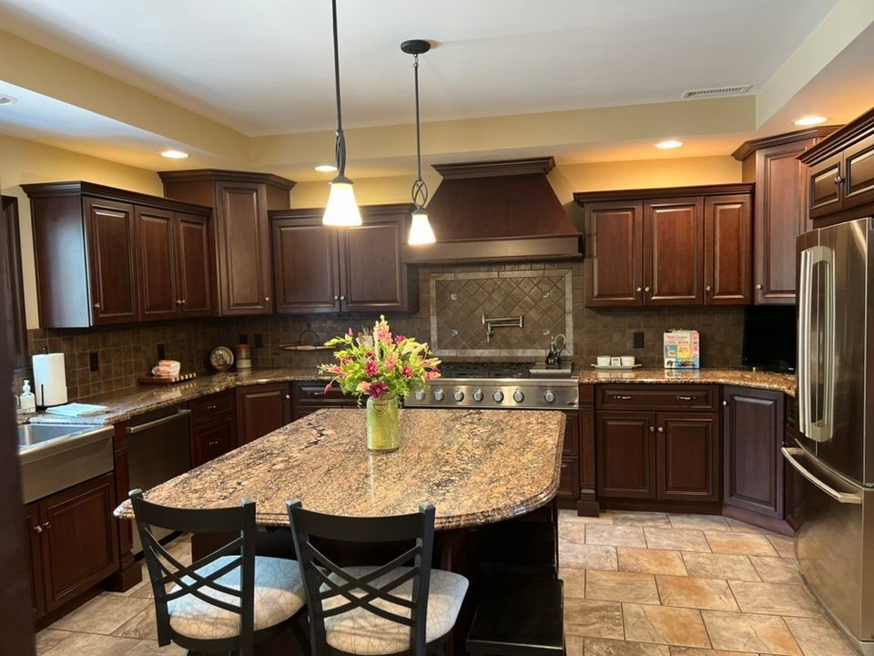 a kitchen with stainless steel appliances and granite counter tops