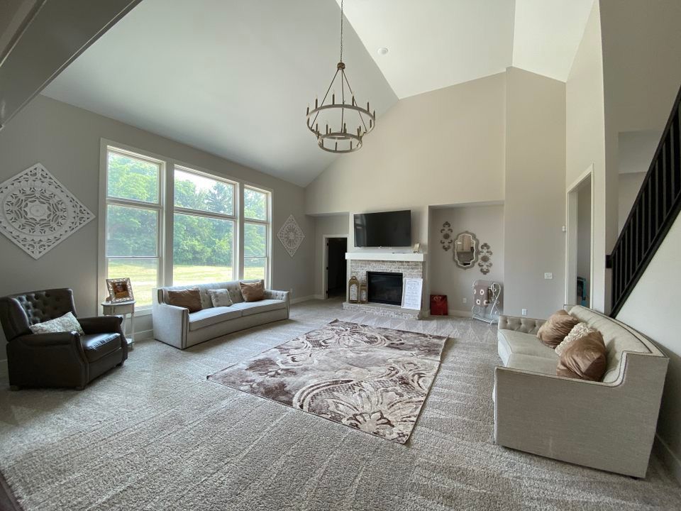 a living room filled with furniture and a fireplace .