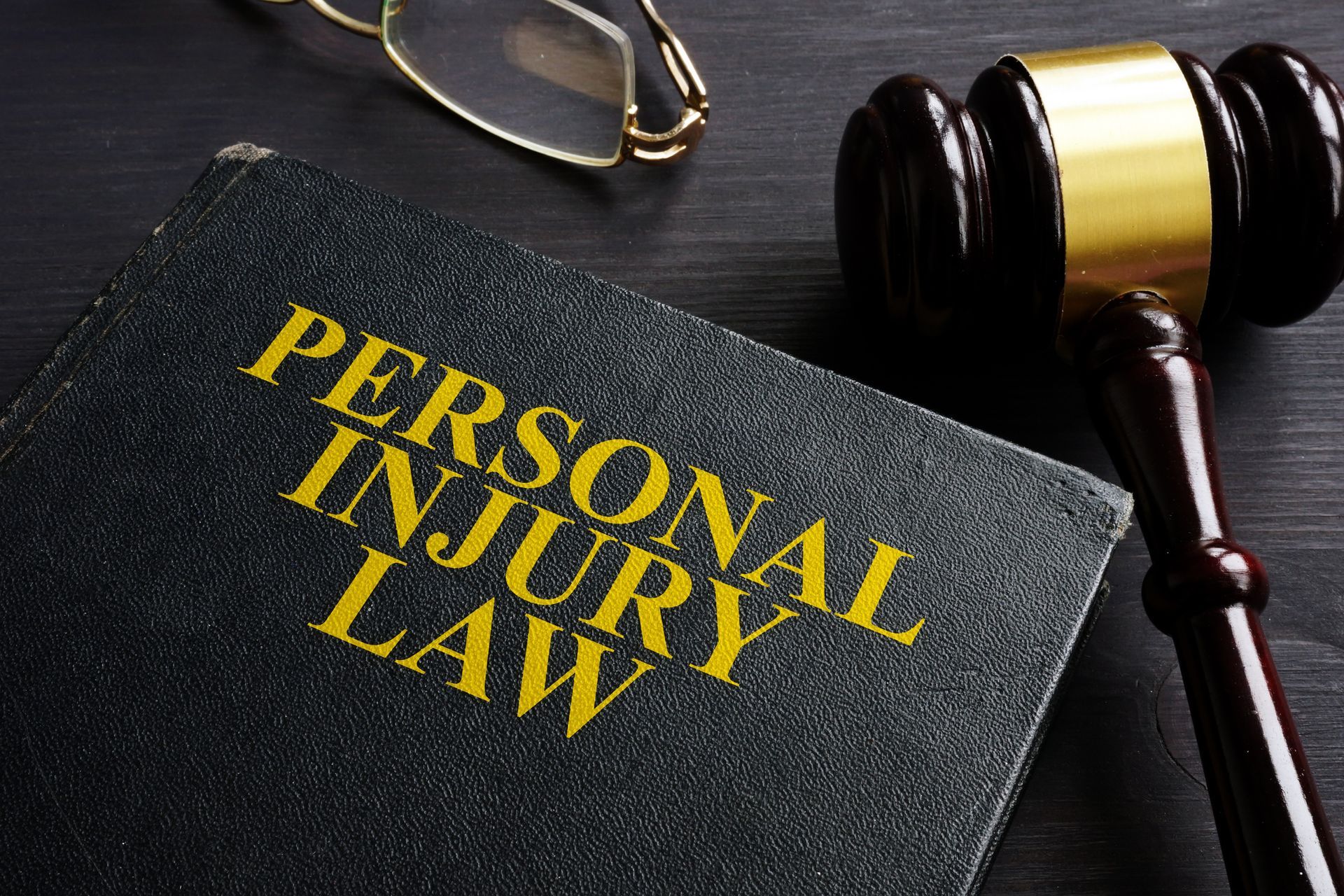 Personal Injury Law Book and a Black Desk | Bowral, NSW | KQ Lawyers