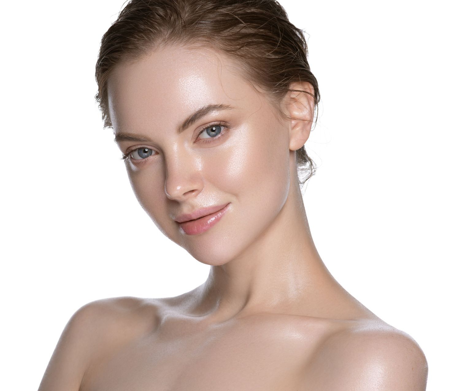 A close up of a woman 's face with a white background.