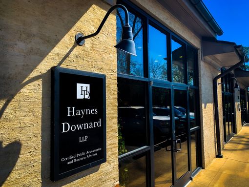 A sign on the side of a building that says haynes downard llp