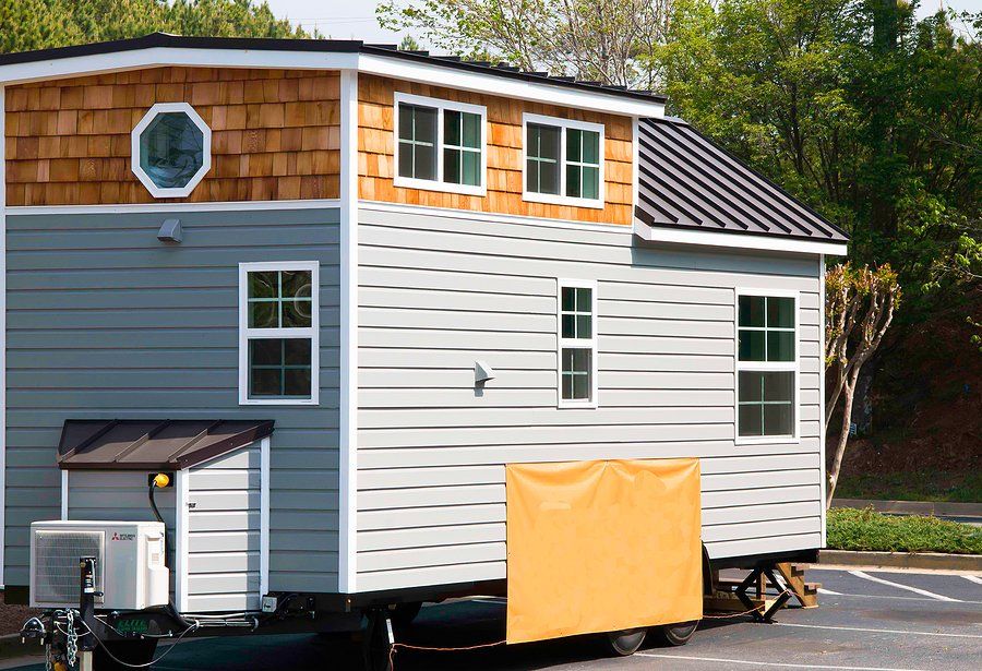 container home with concrete driveway