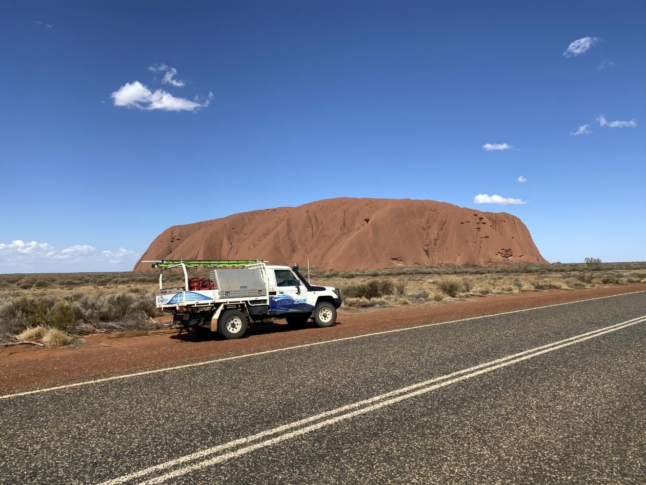 A Truck Is Parked On The Side Of A Road In Front Of A Mountain — ColdZap Refrigeration & Electrical Services In Ciccone, NT