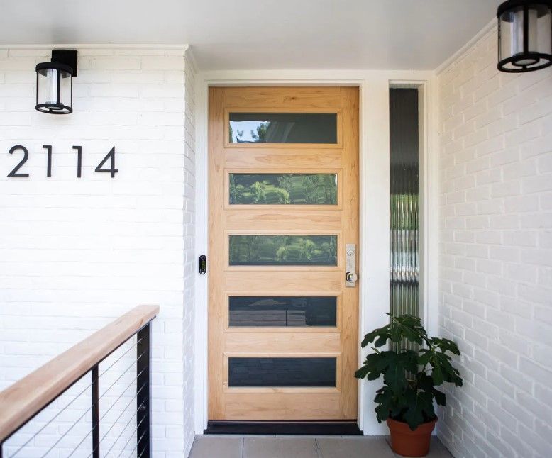 The front door of a house with the number 2114 on it