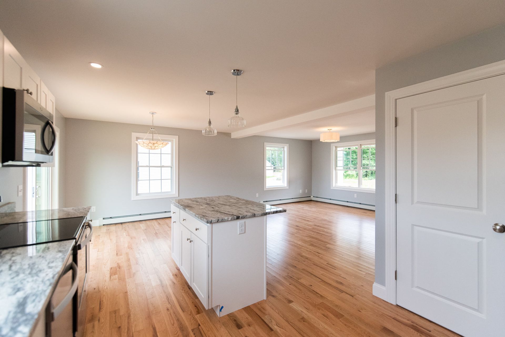 A kitchen with a large island in the middle of the room.