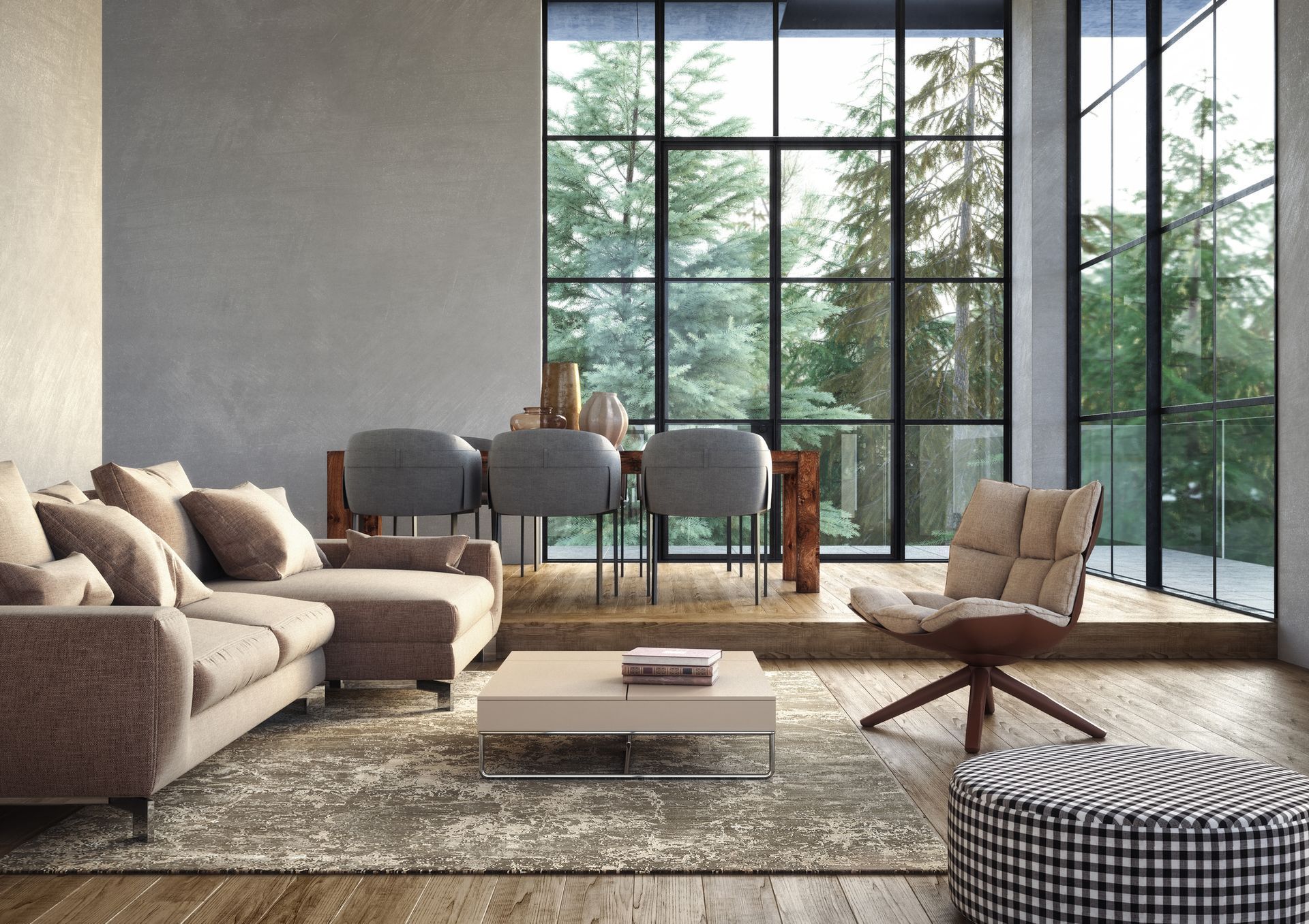 Living room with large windows overlooking trees. Includes a sectional sofa, dining set, and patterned ottoman.