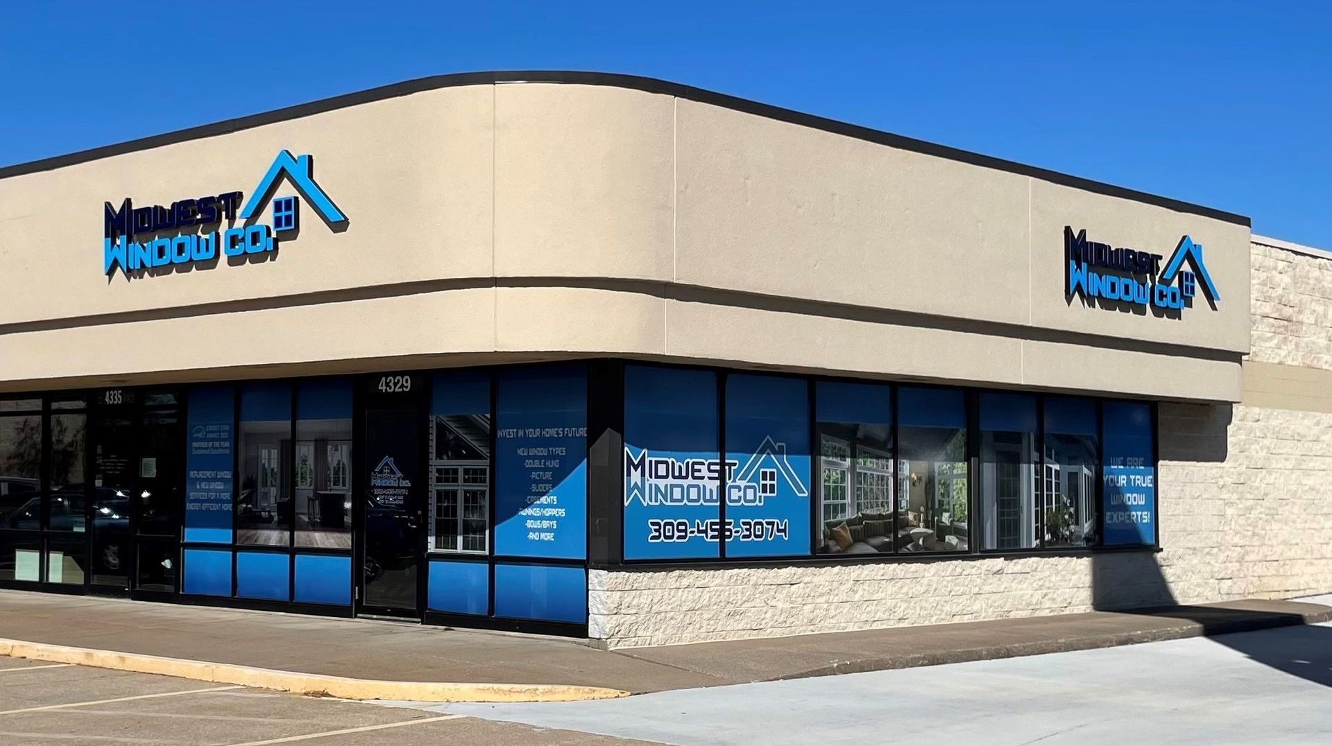 Exterior of a building with blue and white signage: 