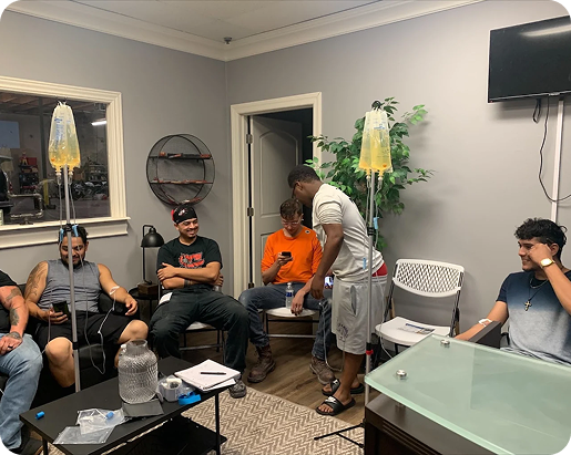 A group of men are sitting in a living room.