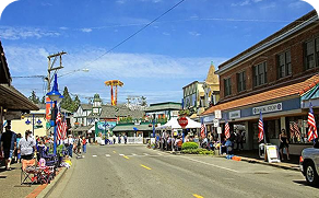 A city street with a ferris wheel in the background