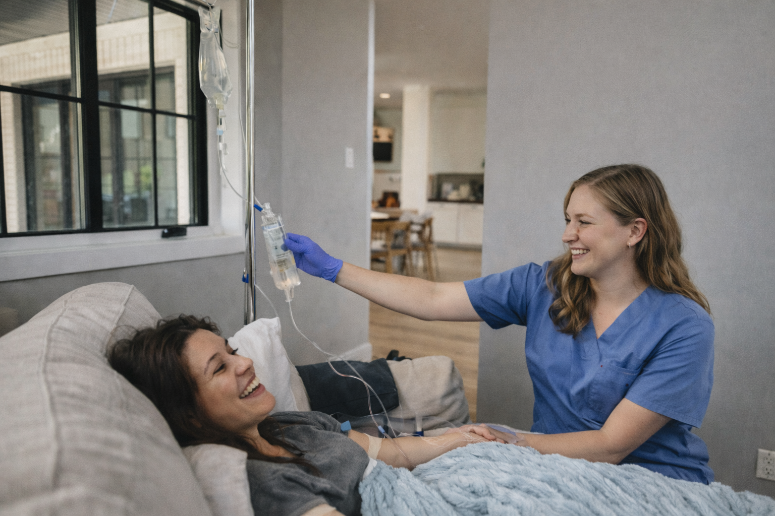woman receiving mobile IV therapy with AQUA MD nurse at home in poulsbo, WA 