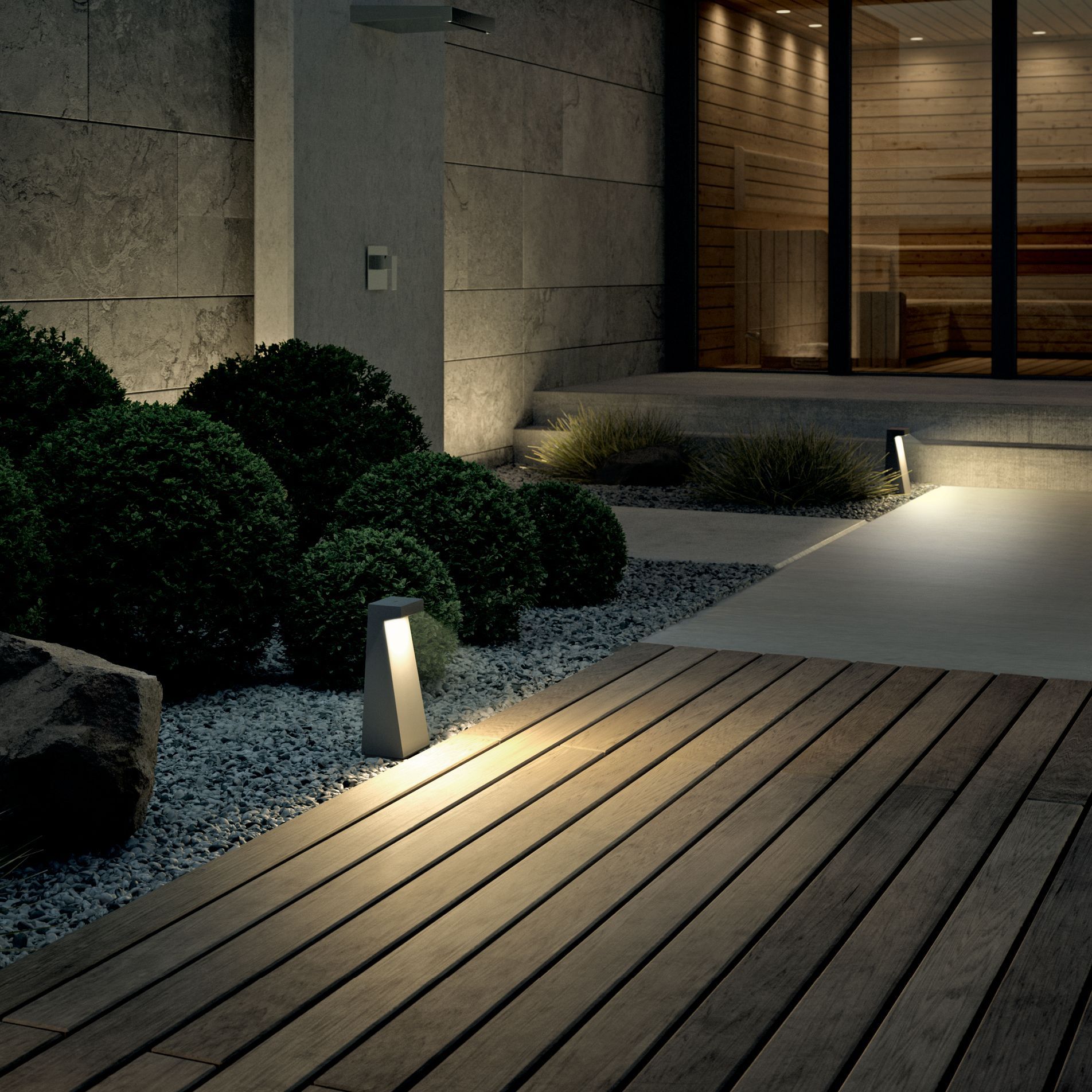 Colorful string lights hanging in a backyard garden, casting a warm and inviting glow during evening.