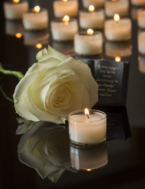 White Rose and Candles - Burial Services in Fort Wayne, IN