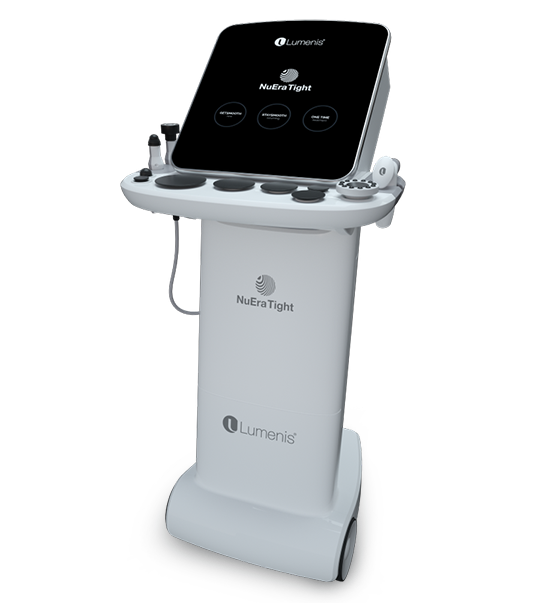 A woman is laying on a bed getting a treatment from a doctor