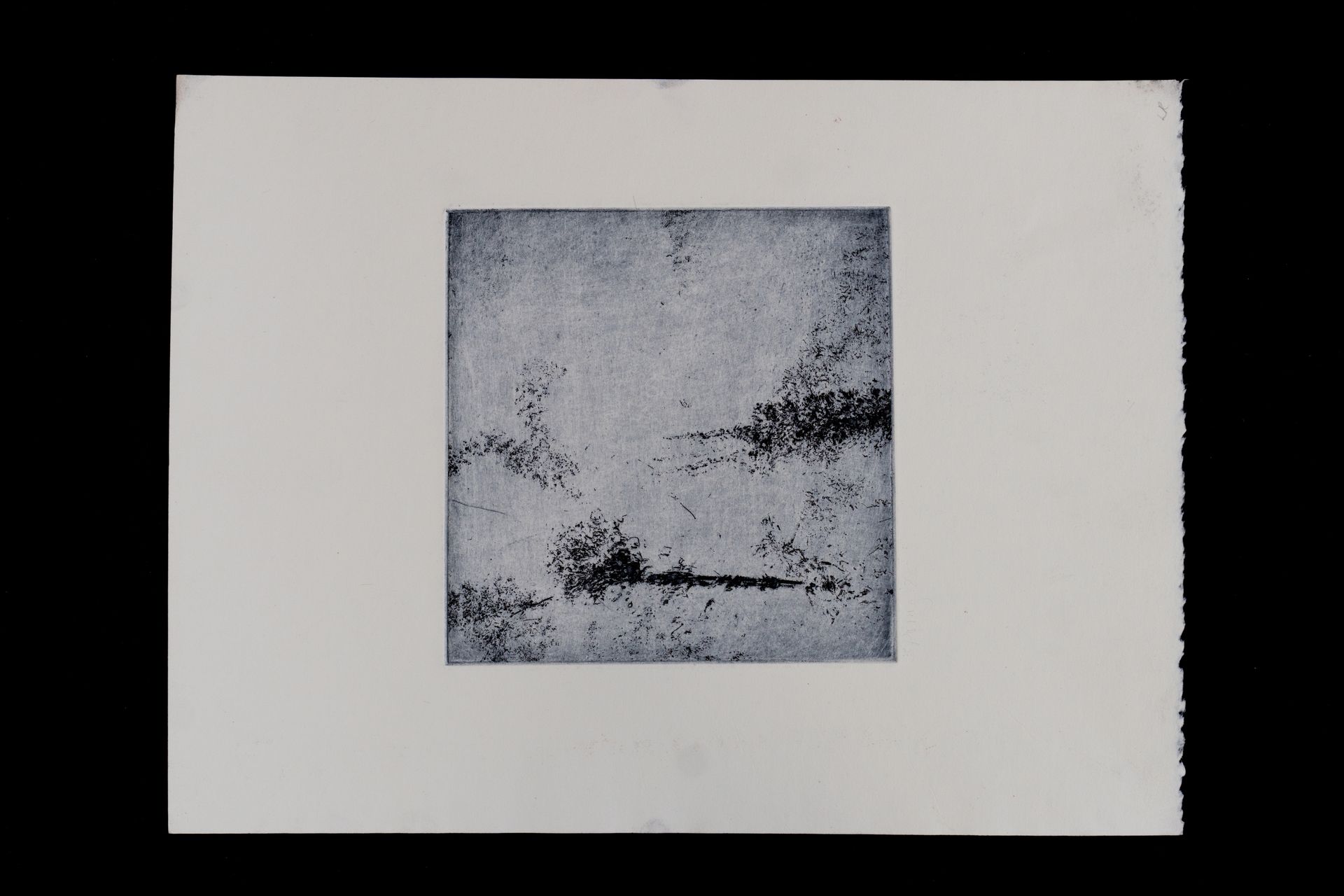 Abstract square print of a landscape; shades of gray and black against a white background.