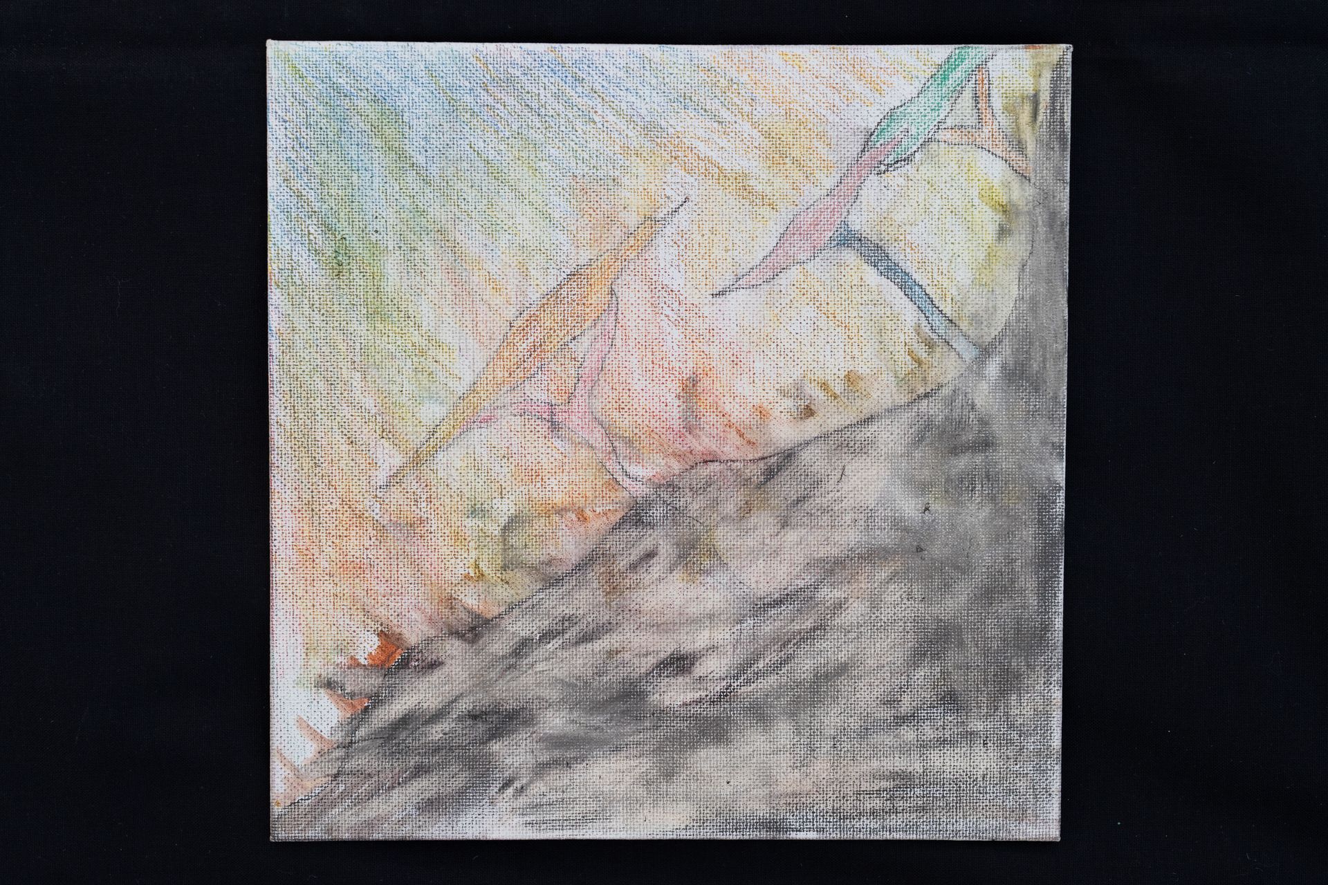 Abstract art with a diagonal gray shape over colorful background.