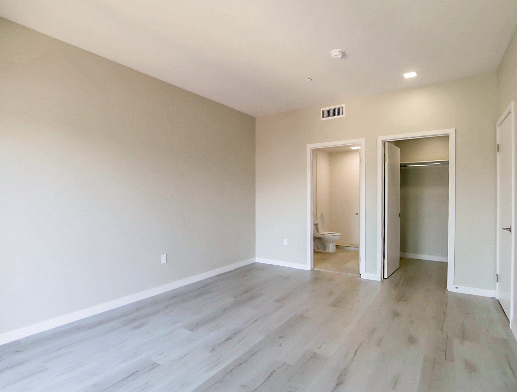 Modern bedroom with hardwood floors
