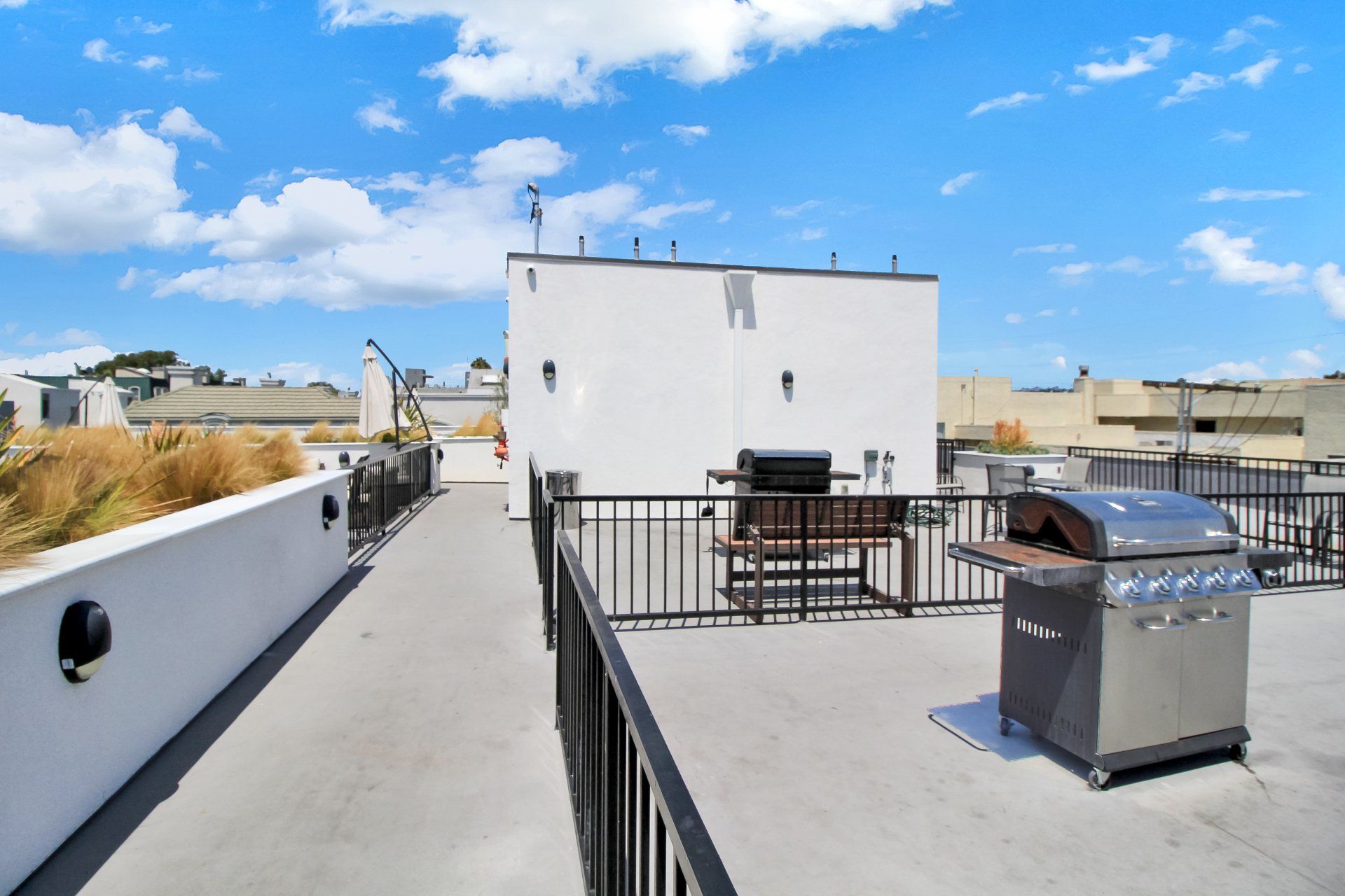 Rooftop deck with barbecue grill.