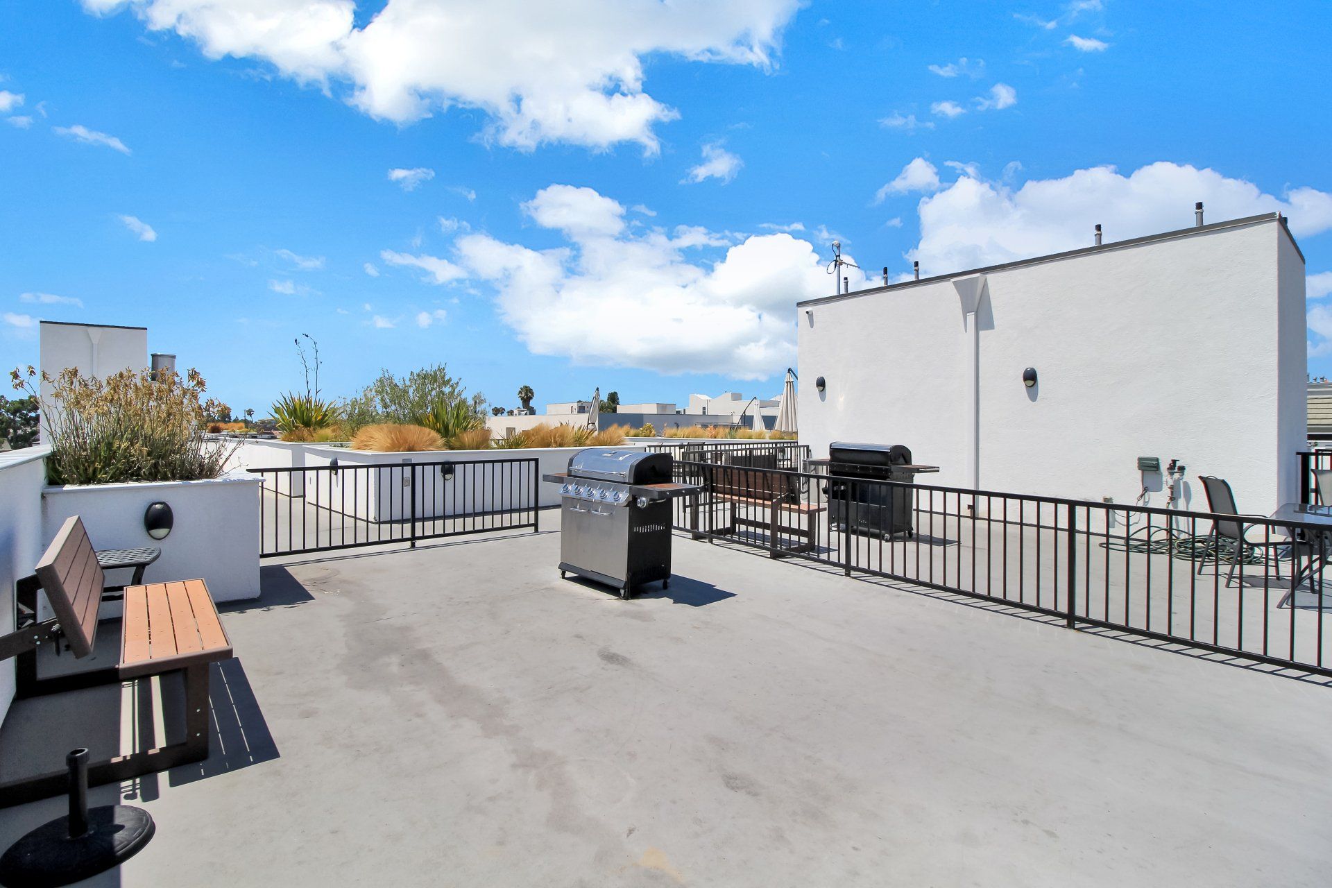 Rooftop deck with barbecue grill.