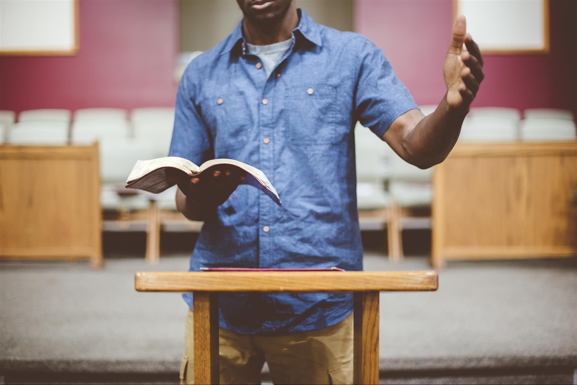 Person studying a Bible on a table