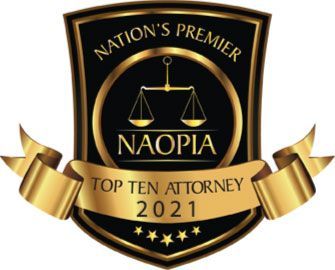 A badge that says nation 's premier top ten attorney 2021