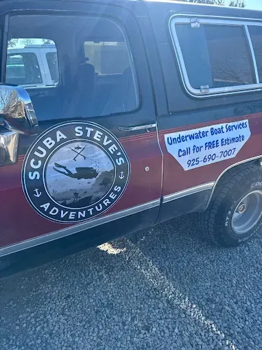 Side of a red and black truck with 