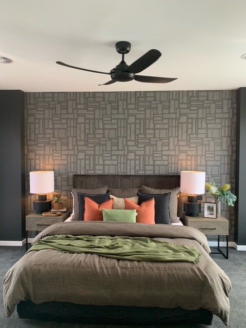 Black ceiling fan inside the gray bedroom