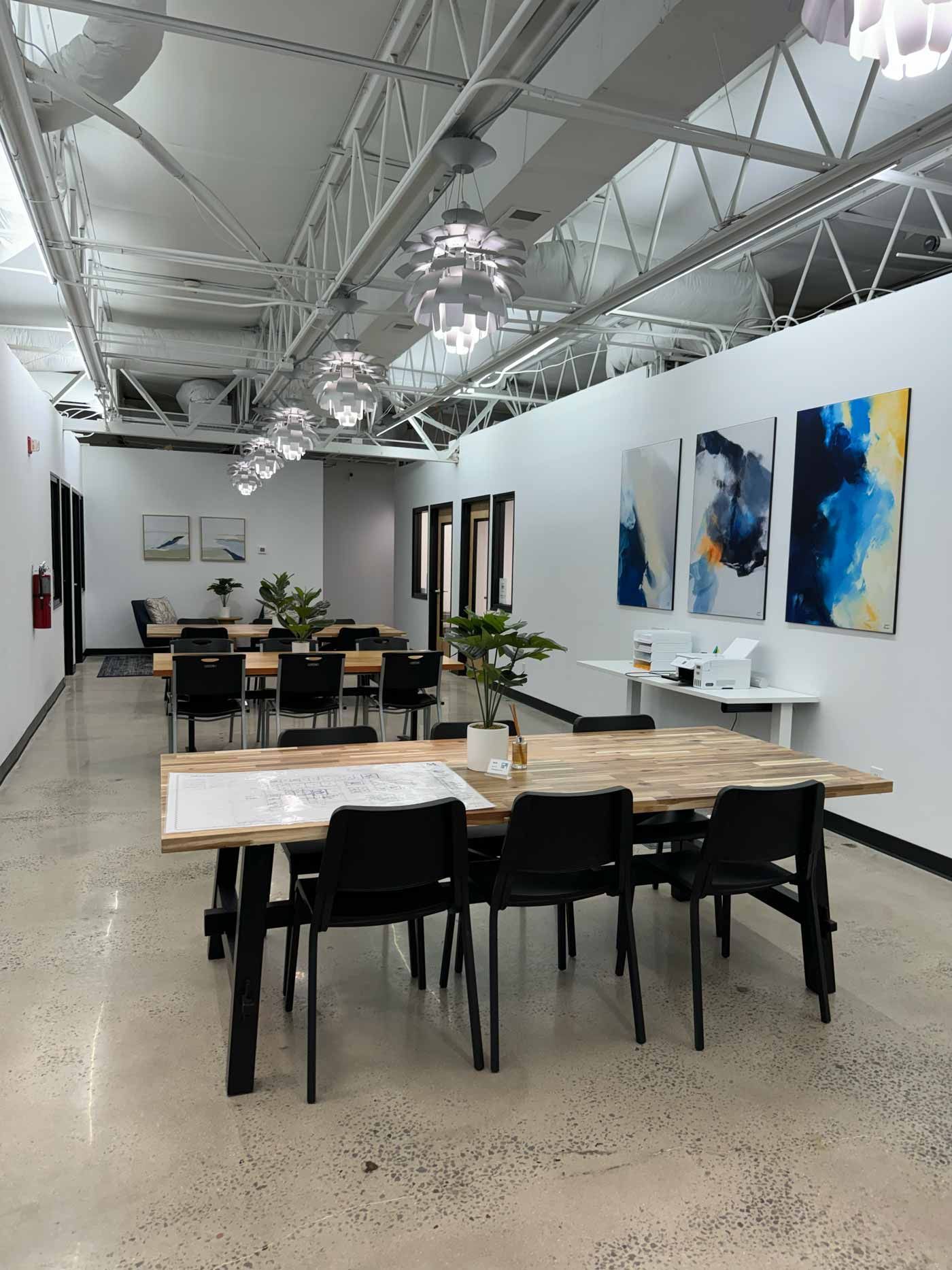 Outdoor patio with pergola, fireplace, and dining table on a sunny day.
