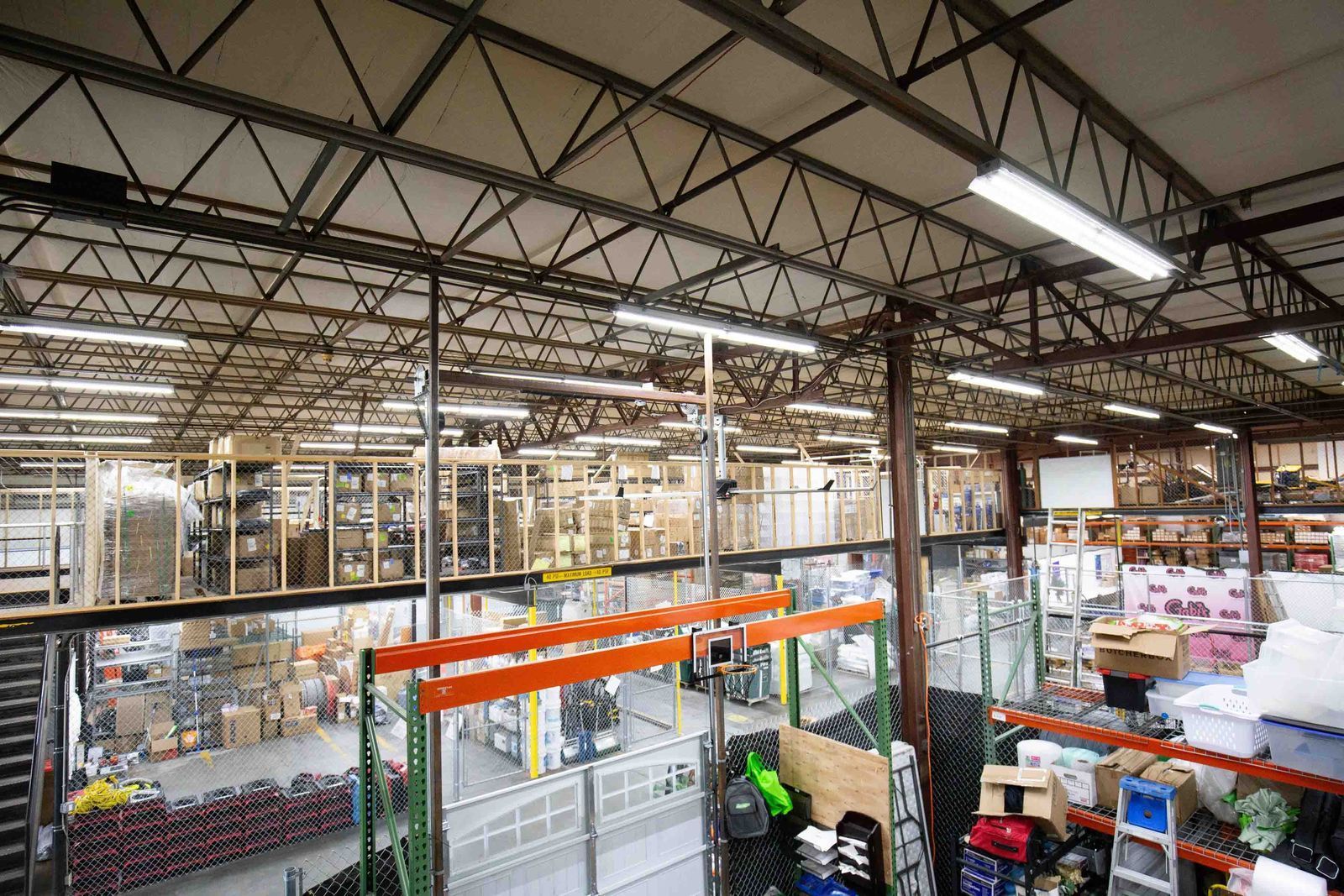 Outdoor patio with pergola, fireplace, and dining table on a sunny day.