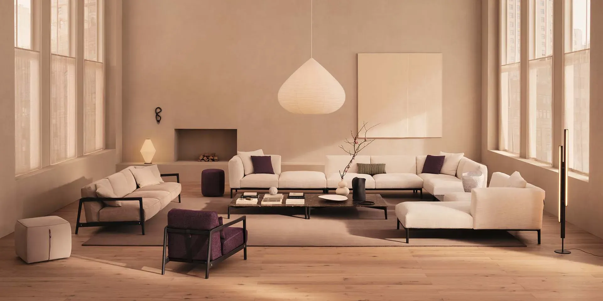 Modern living room with neutral tones. White sofas, a dark wood coffee table, and a large blank canvas are set against a light beige wall.