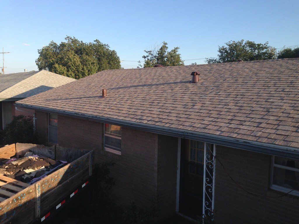 a house with a roof that has shingles on it