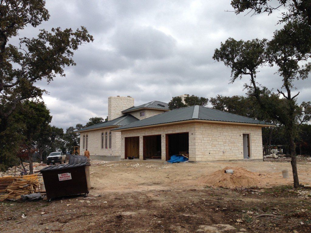 a dumpster in front of a house has a warning sign on it