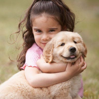 a girl holding the dog