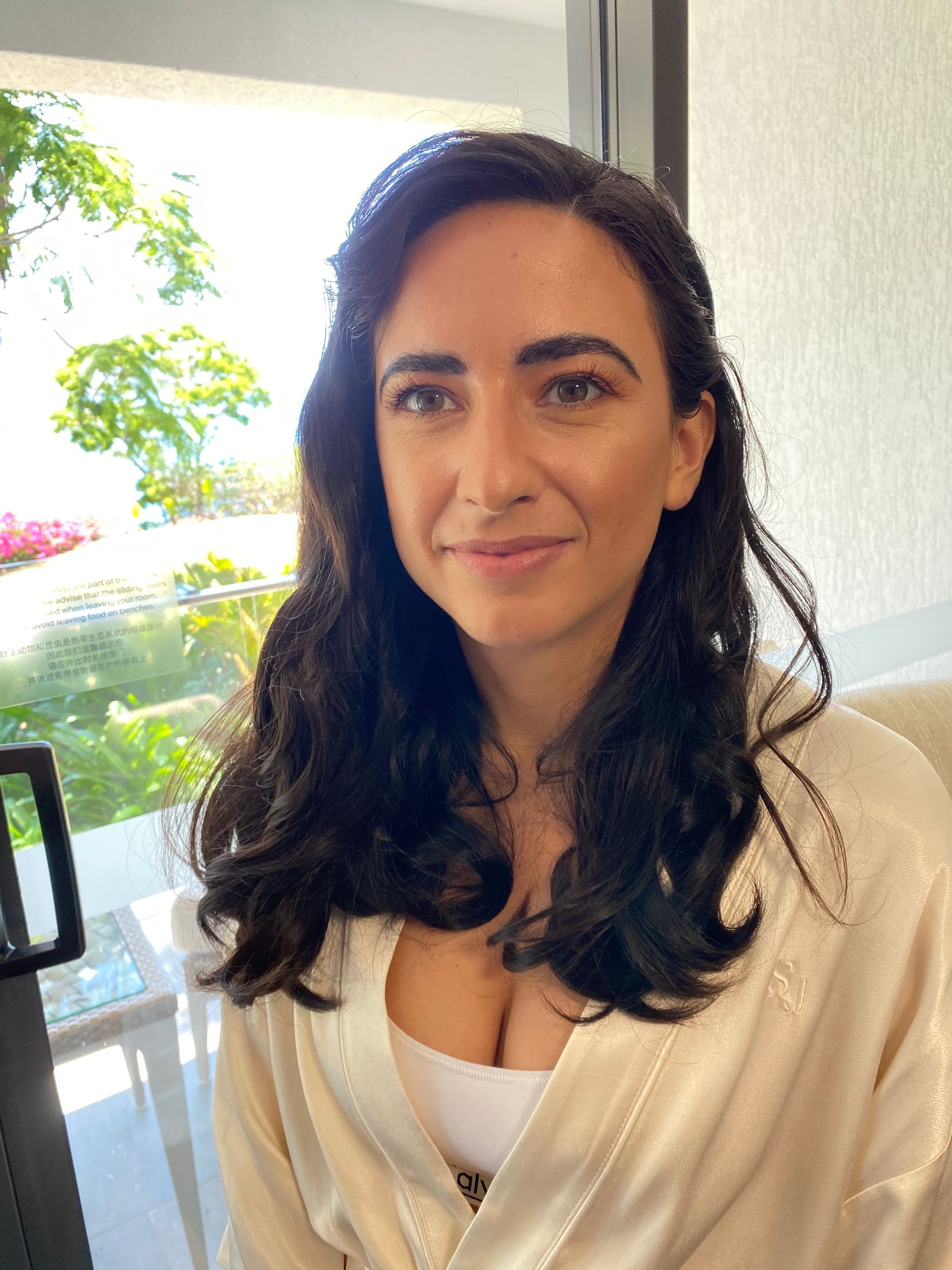 A Woman in A Wedding Dress Is Holding a Bouquet of Flowers β Apricate & Wild Salon in Airlie Beach, QLD