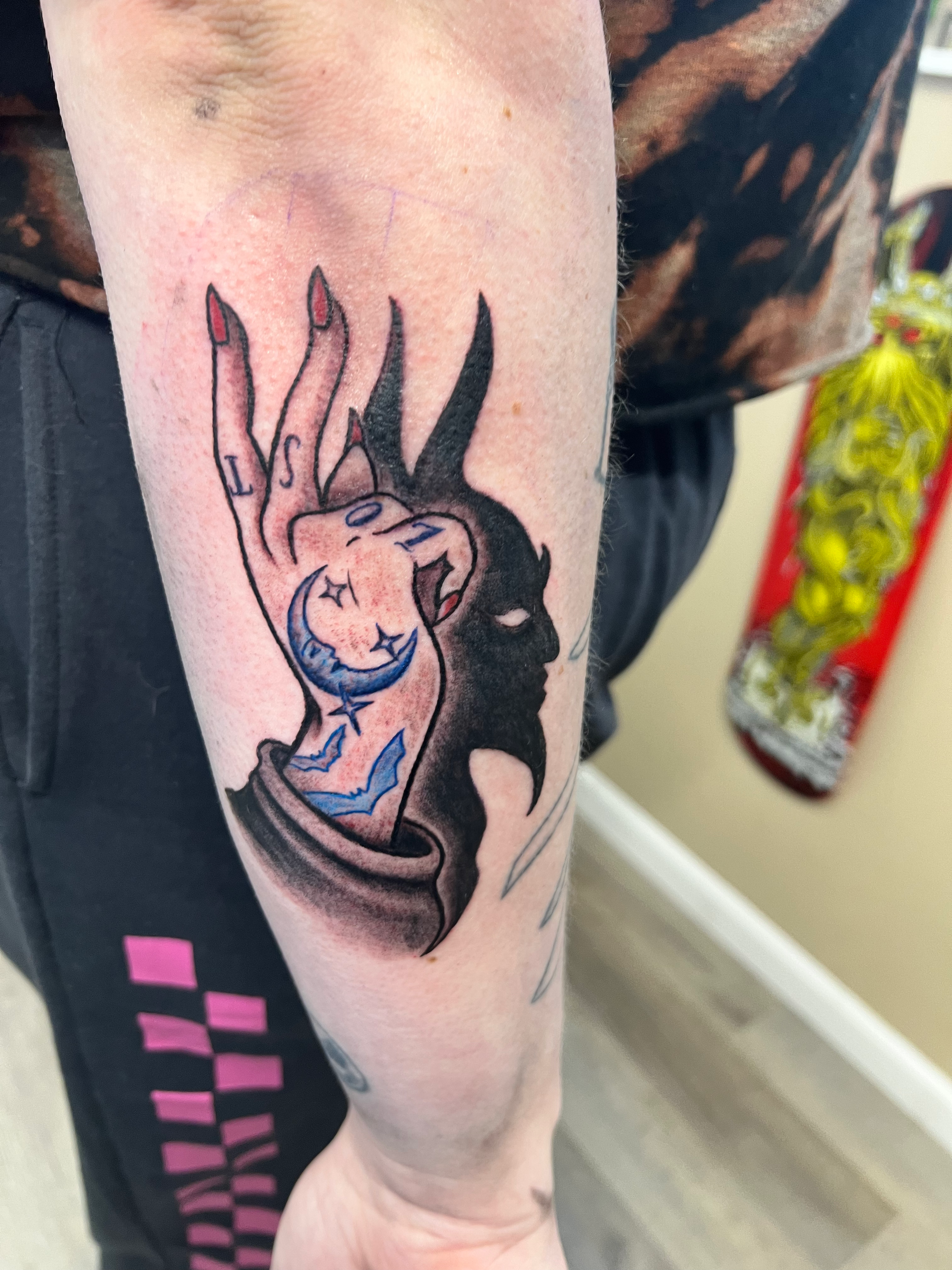 Two fingers with devil shadow tattoo