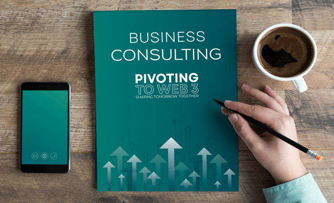 A person is writing on a piece of paper that says business consulting pivoting.
