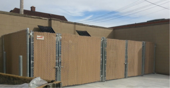 Tall Chain Link Fence with Tan Slat — Warren, MI — Kimberly Fence & Supply