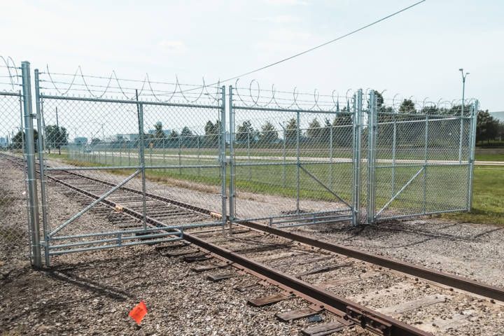 Double-Swing Chain Link Gate With Razor Ribbon And Barb Wire — Warren, MI — Kimberly Fence & Supply