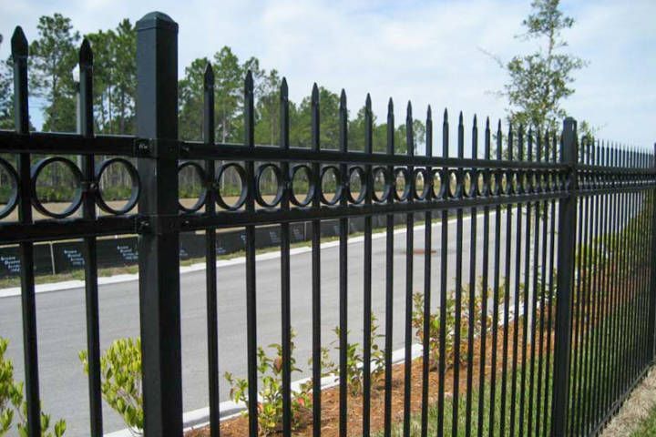 Black Wrought Iron Fence Along A Road — Warren, MI — Kimberly Fence & Supply