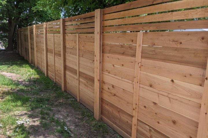 Wooden Fence Surrounded By Grass — Warren, MI — Kimberly Fence & Supply