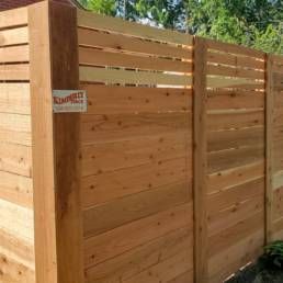 Fence With A Sign On The Side Of It — Warren, MI — Kimberly Fence & Supply
