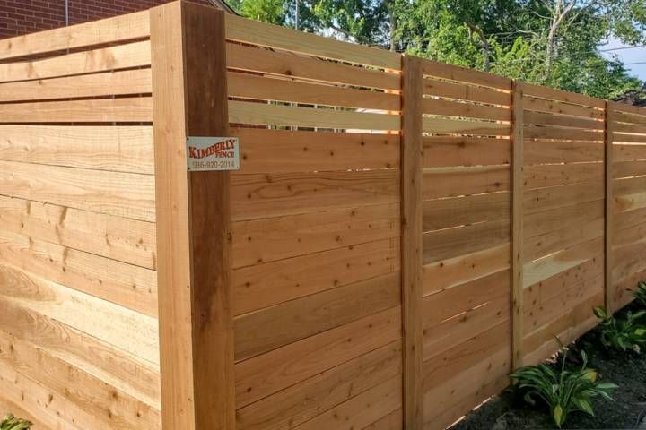 Wooden Fence With A Sign — Warren, MI — Kimberly Fence & Supply